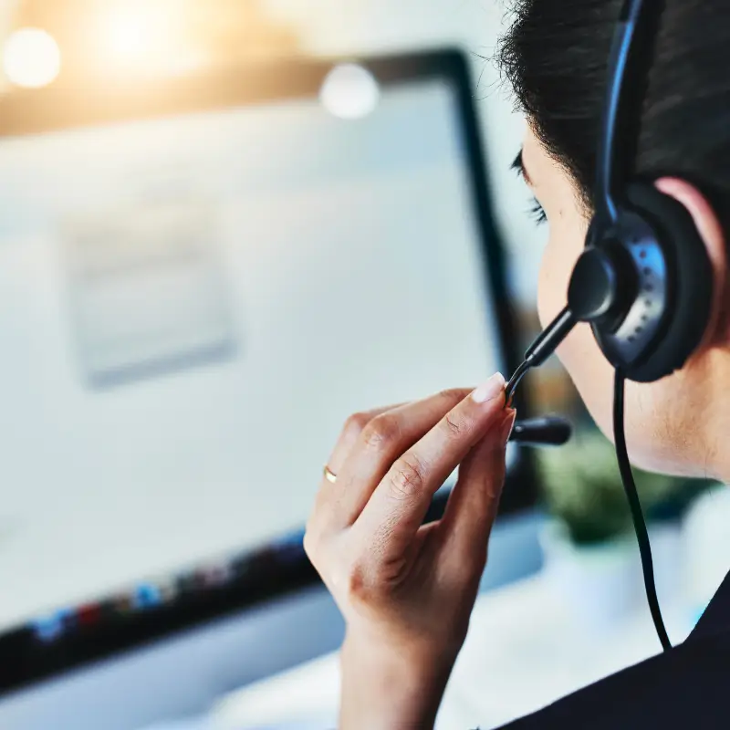 Woman in a headset adjusting the microphone