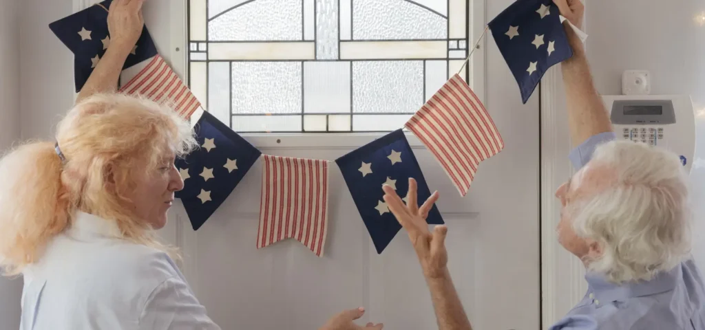 People hanging patriotic flag banner
